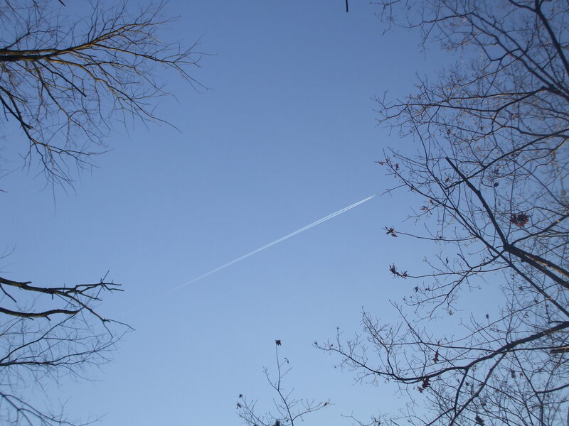 airplane trail in blue sky