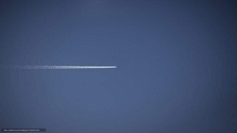 Airplane trail in blue sky