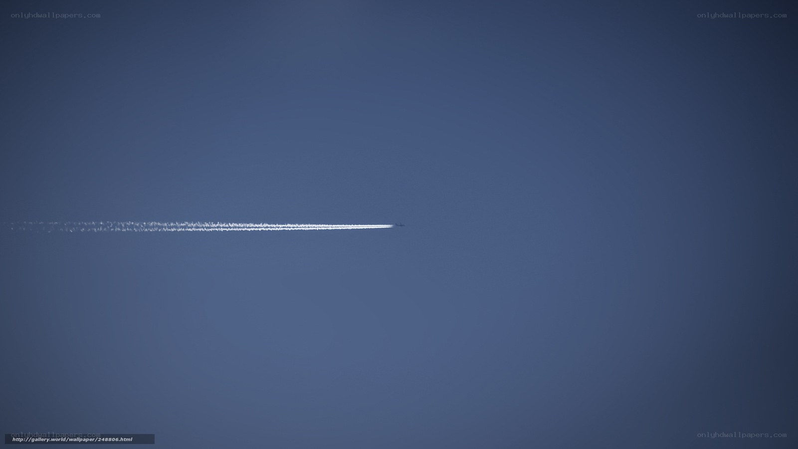 Airplane trail in blue sky