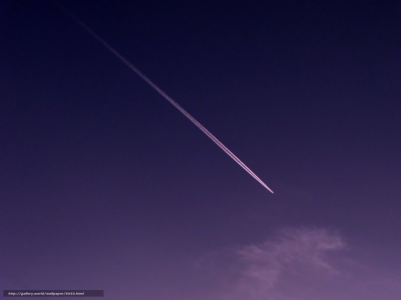 airplane trail in purple sky