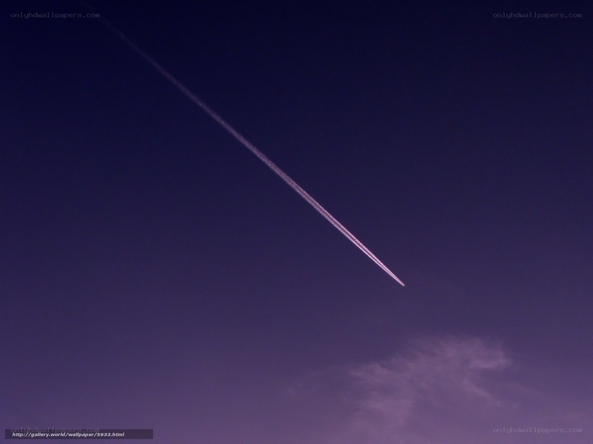 airplane trail in purple sky