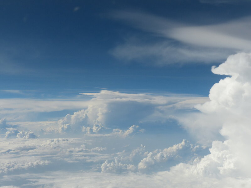 Airplane View of Clouds — Blue, Serene, Afternoon