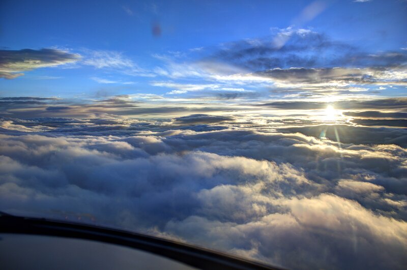 Airplane View of Clouds — Blue, Serene, Sunset