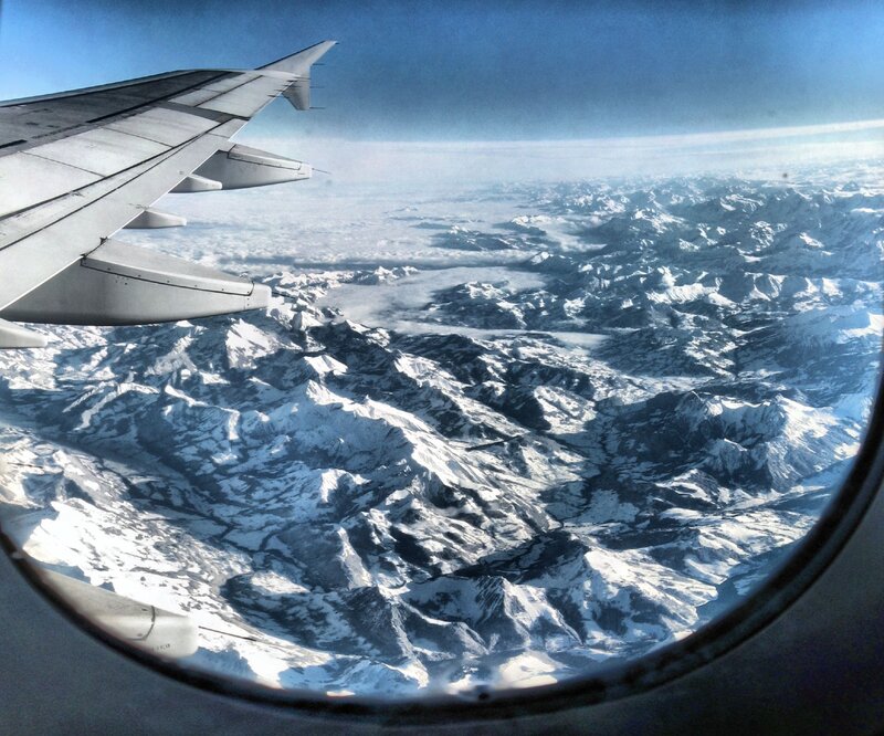 airplane view of snowy mountains