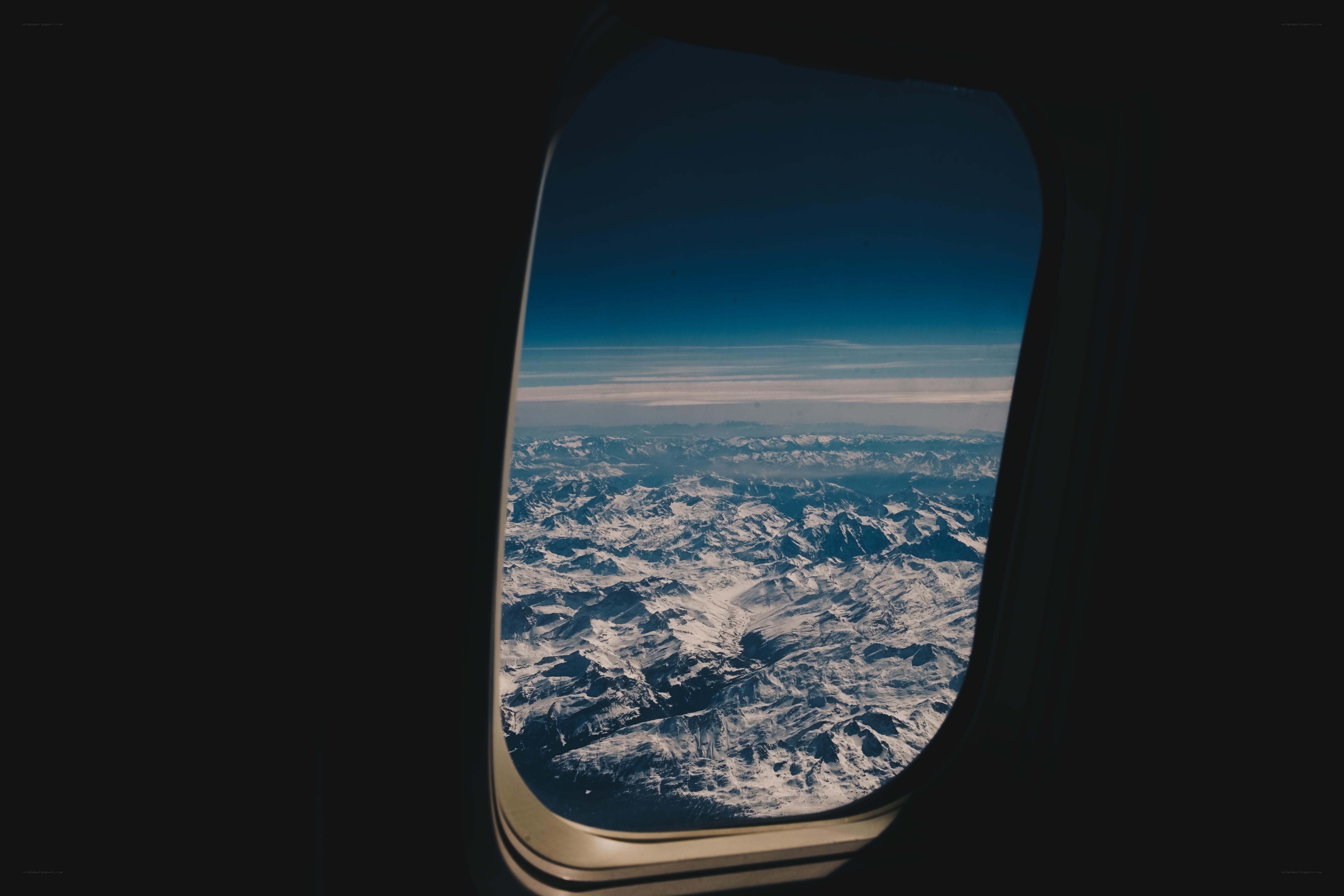 airplane window view of mountains