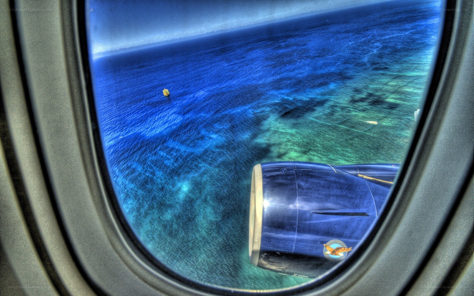 Airplane window view of ocean