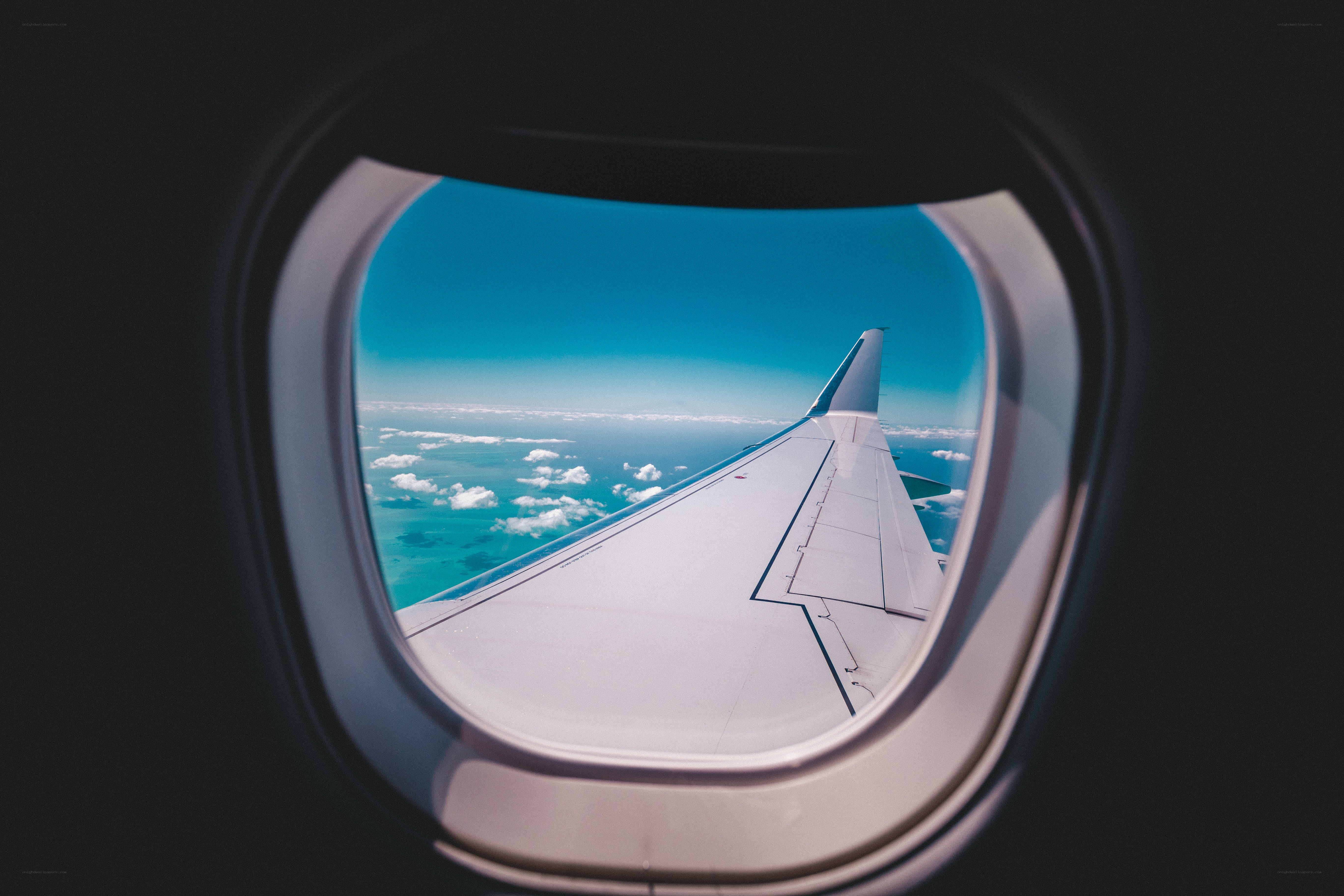 Airplane window view of wing