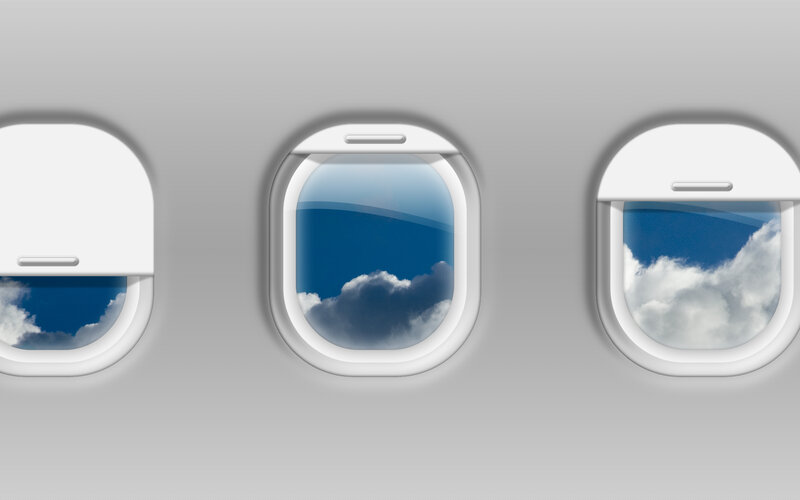 Airplane windows with clouds