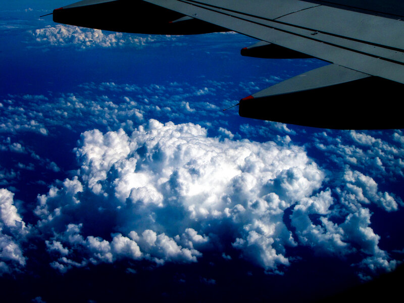 Airplane wing above clouds
