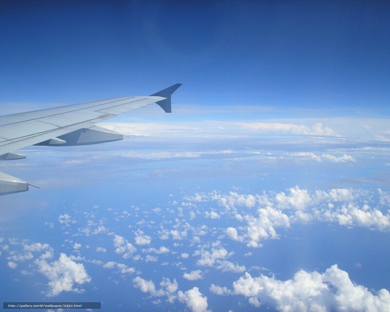 Airplane wing above clouds