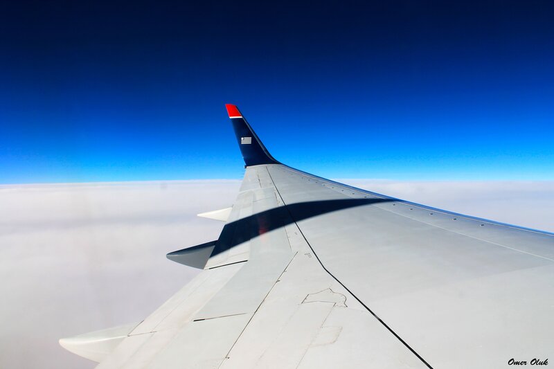Airplane wing above clouds