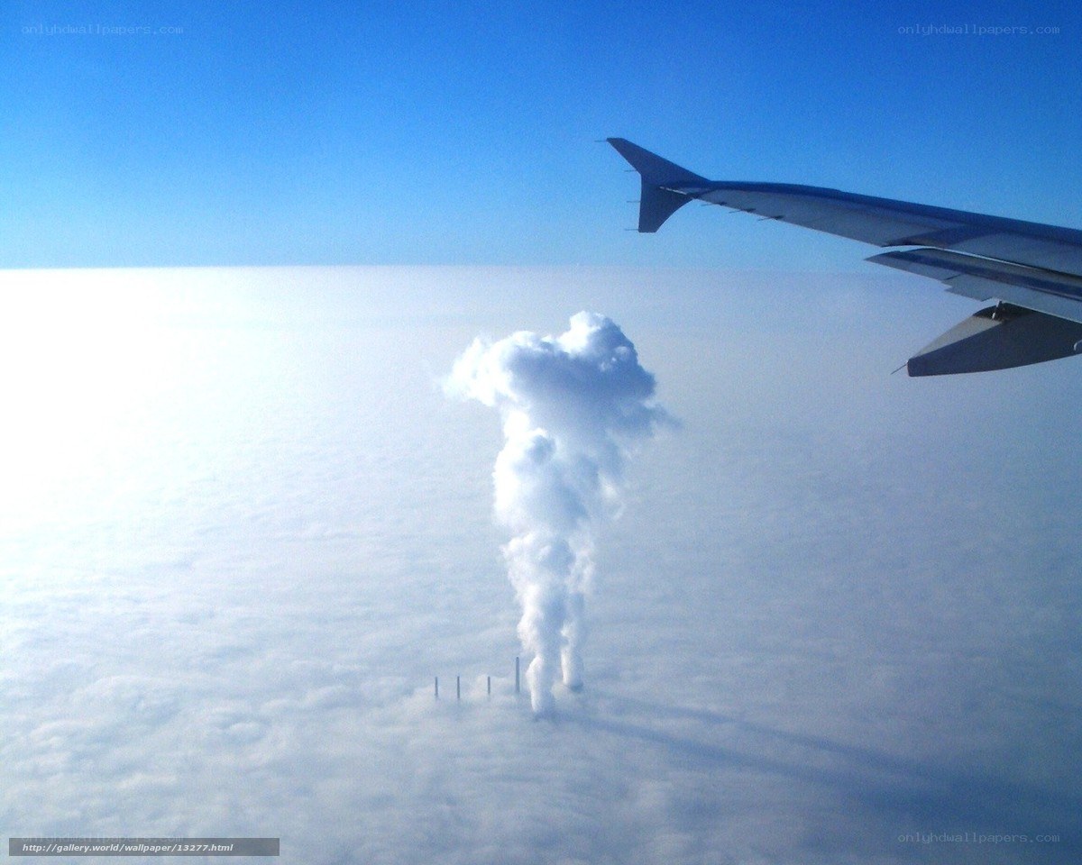airplane wing above clouds