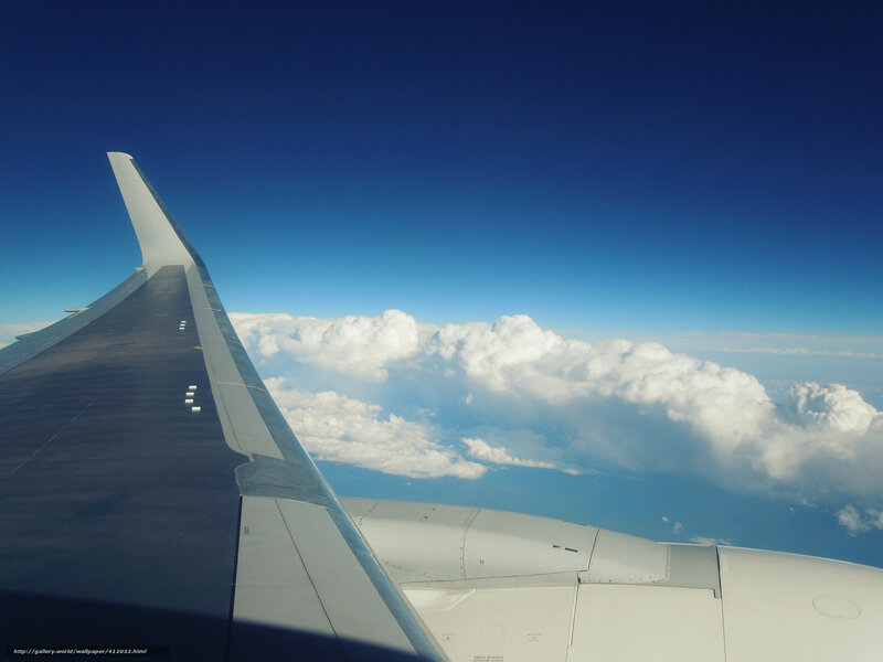 airplane wing above clouds