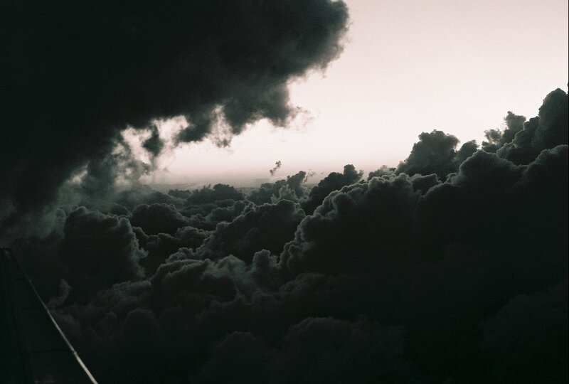 Airplane Wing Above Clouds — Black