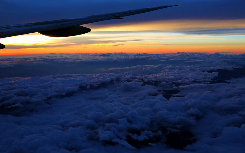 Airplane Wing Above Clouds — Blue, Dramatic, Sunset