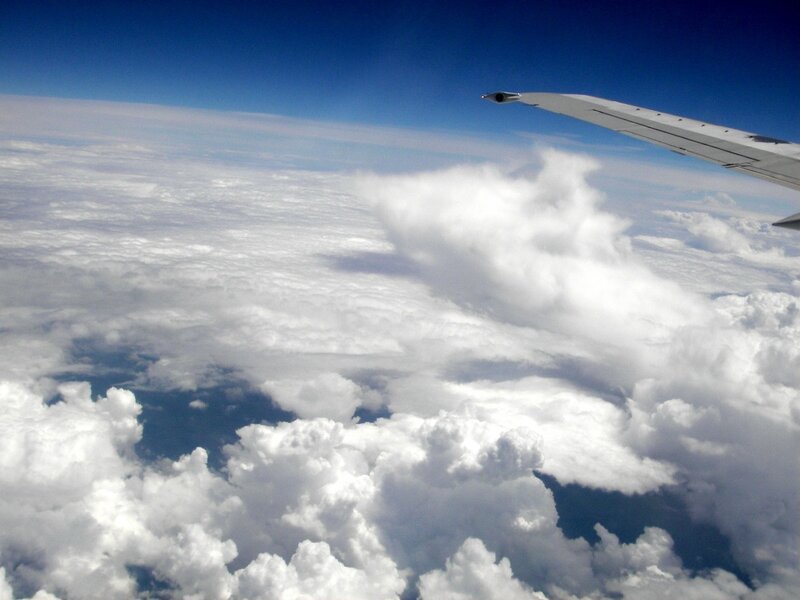 Airplane Wing Above Clouds — Blue, Serene, Afternoon, Photograph, Airplane Wing