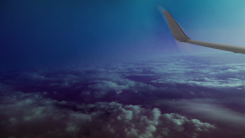 Airplane Wing Above Clouds — Blue, Serene, Night, Photograph