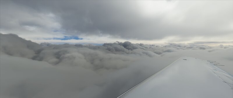 Airplane Wing Above Clouds — Gray, Overcast