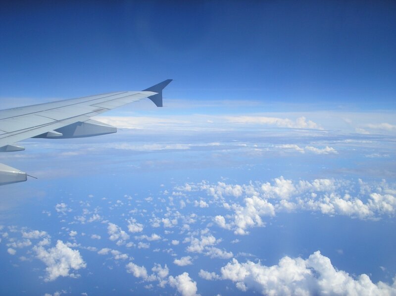 Airplane Wing Above Clouds — Sky