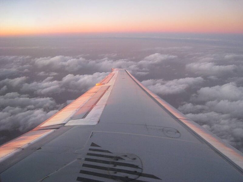 Airplane Wing Above Clouds — White, Serene