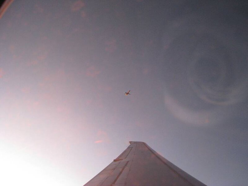 Airplane Wing and Distant Aircraft