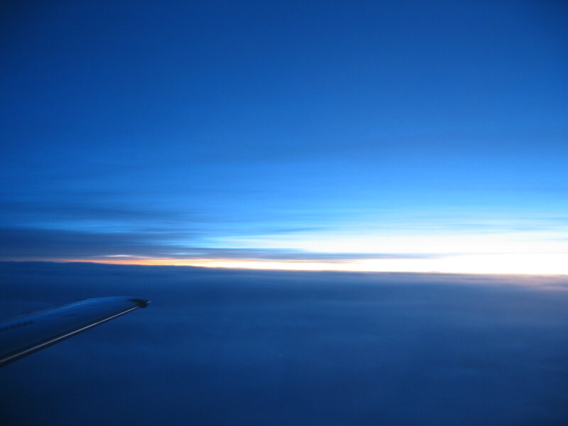 airplane wing at sunrise
