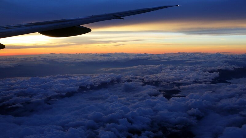 Airplane wing at sunset