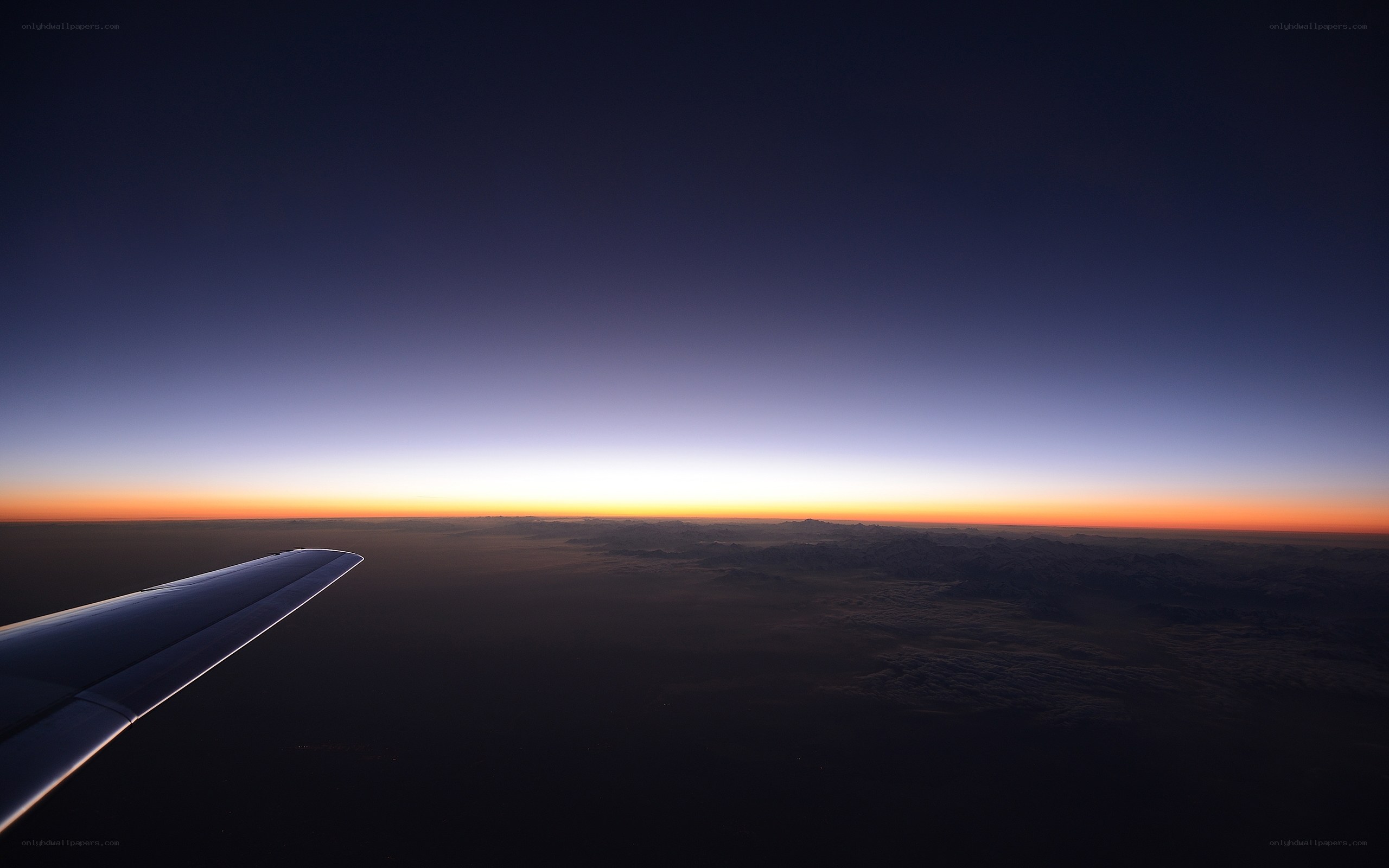 airplane wing at sunset