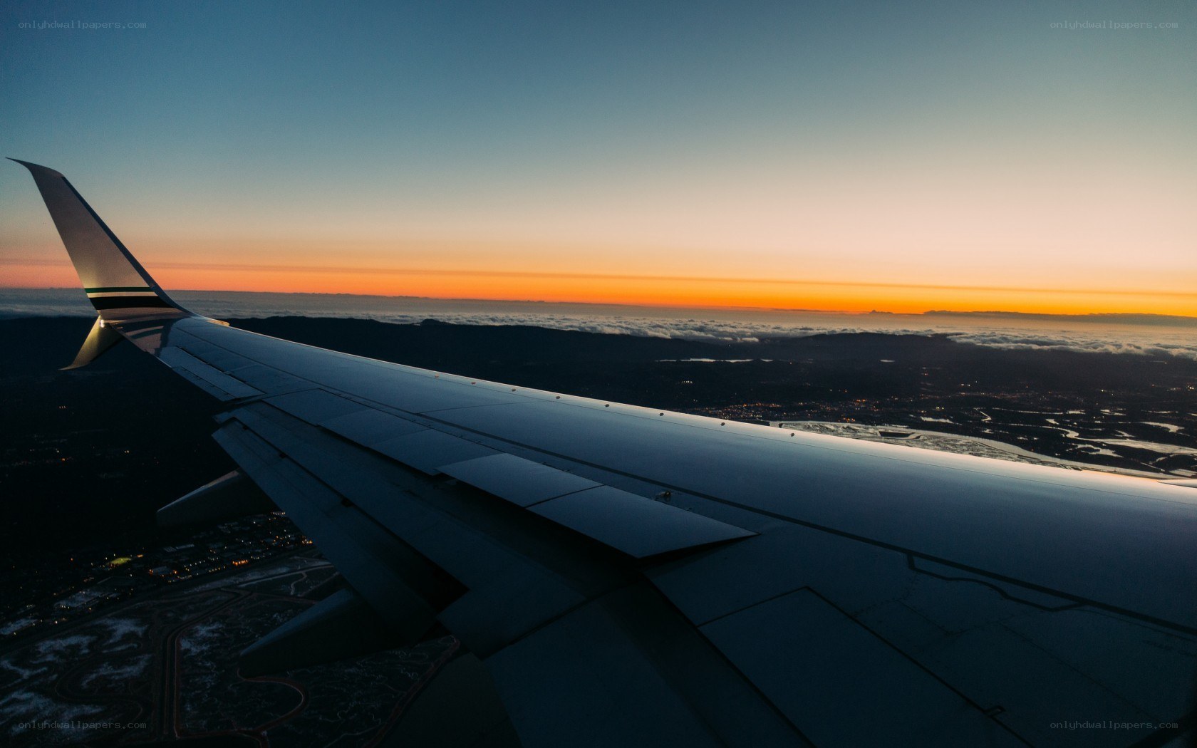airplane wing at sunset