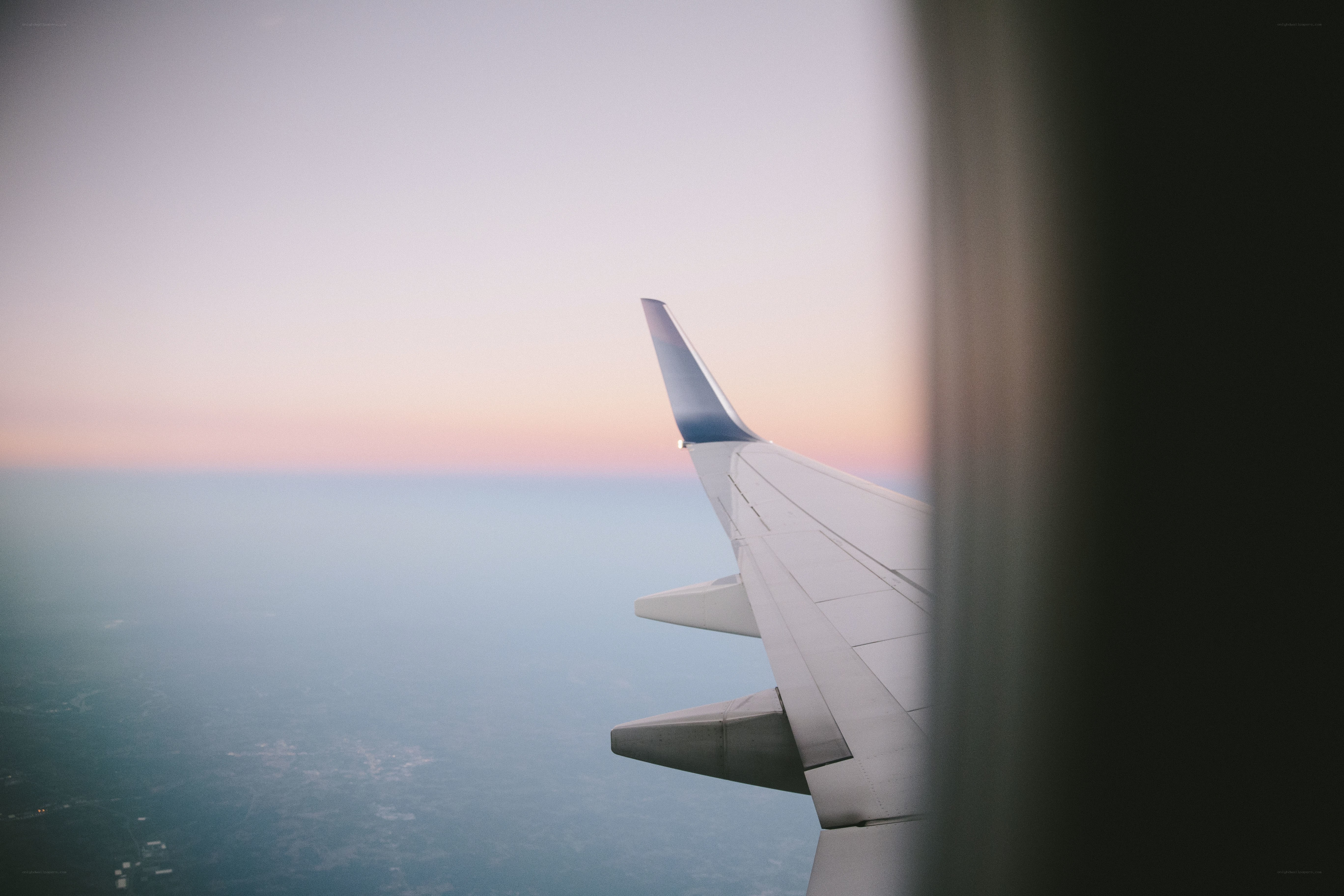 Airplane wing at sunset