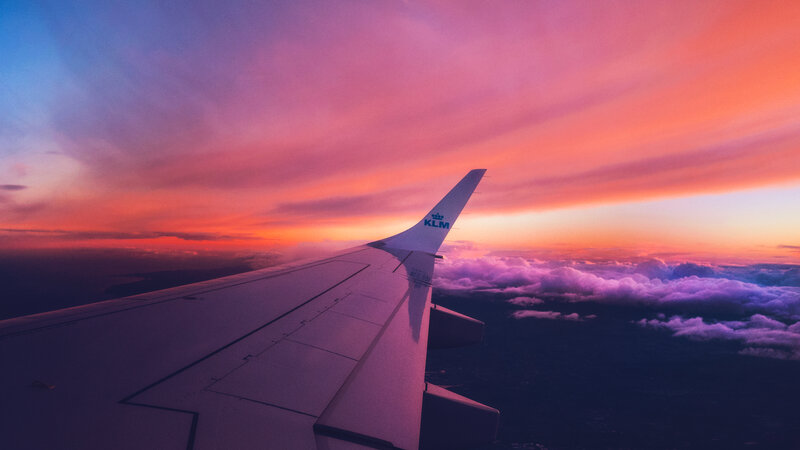 Airplane wing at sunset