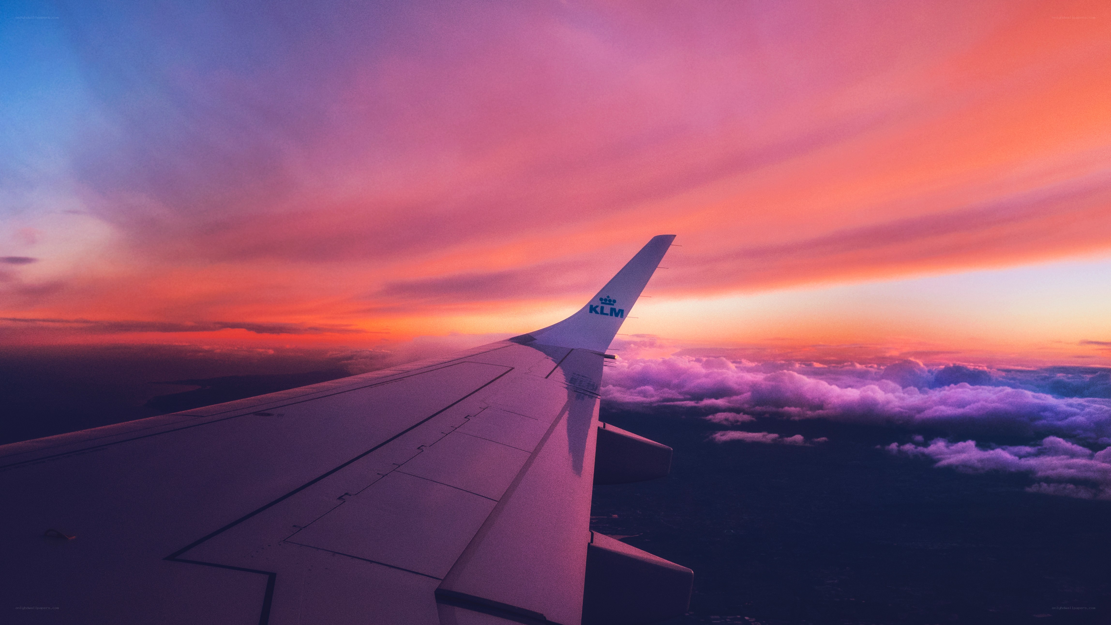 Airplane wing at sunset