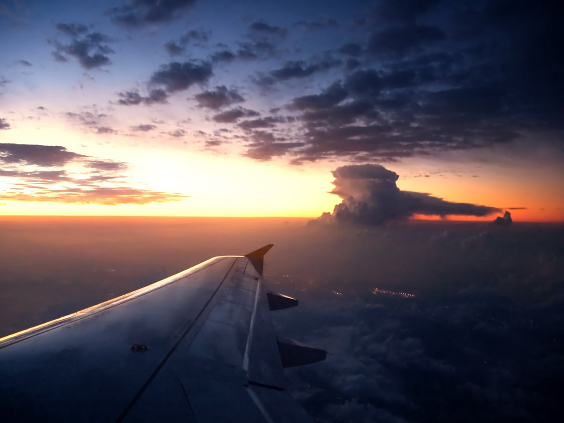 airplane wing at sunset