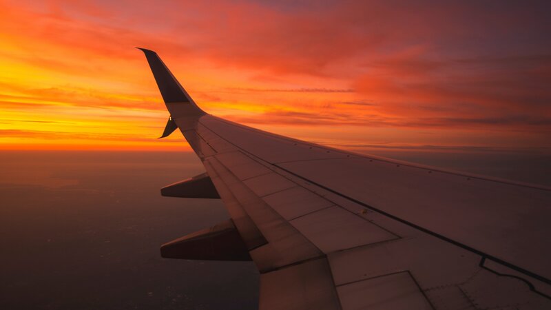Airplane Wing at Sunset — Orange, Dramatic, Photograph