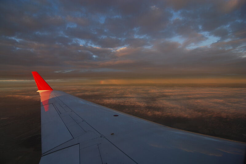 Airplane Wing at Sunset — Red, Dramatic