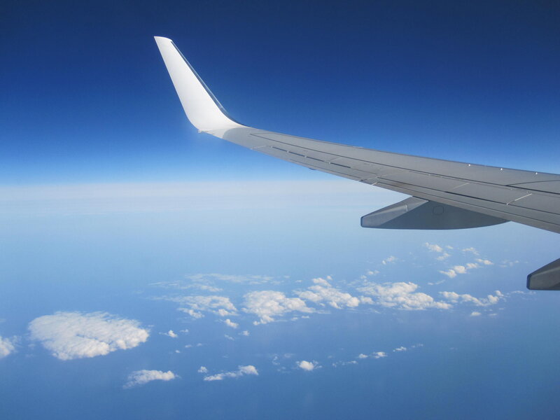 Airplane Wing in Flight — Blue, Serene, Afternoon