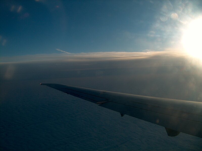 Airplane Wing in Flight — Blue, Serene, Sunset