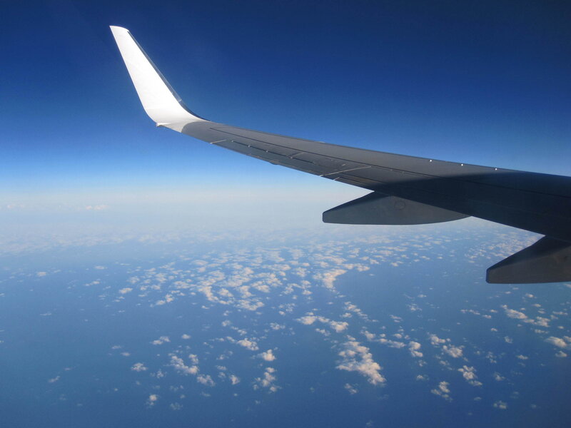 Airplane Wing in Flight — Blue