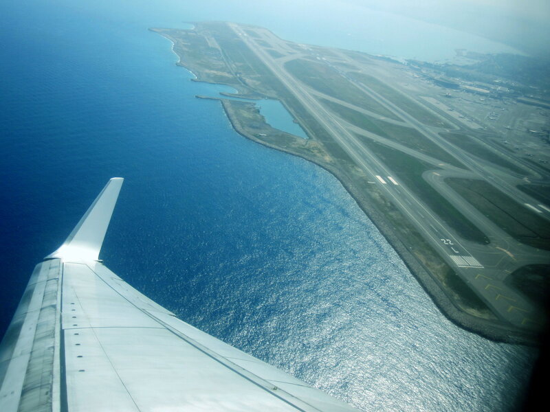 Airplane Wing over Airport