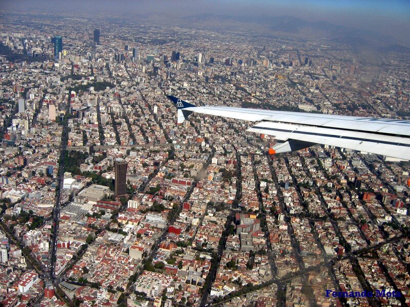 Airplane Wing over City — White