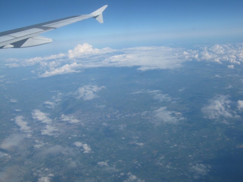 Airplane Wing over Clouds — Blue, Serene, Afternoon