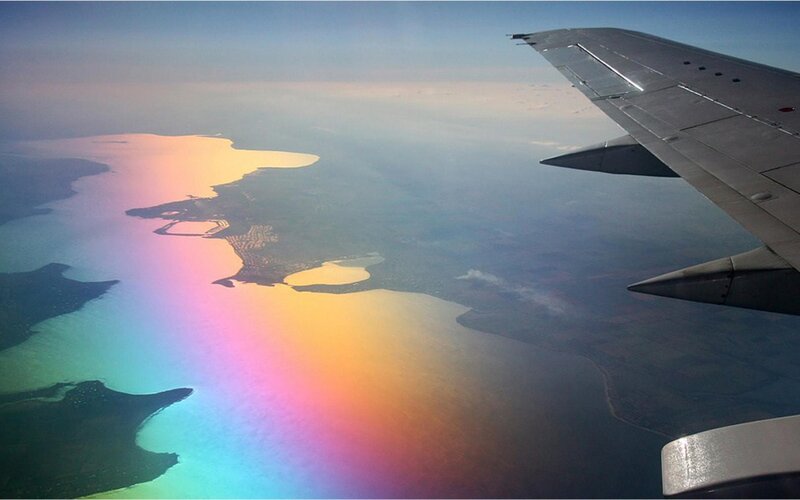 Airplane Wing over Coastline