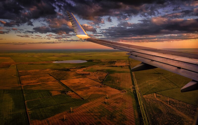 Airplane Wing over Fields