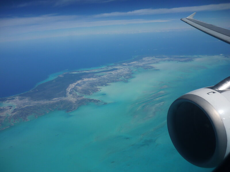 Airplane Wing over Island — Blue, Serene