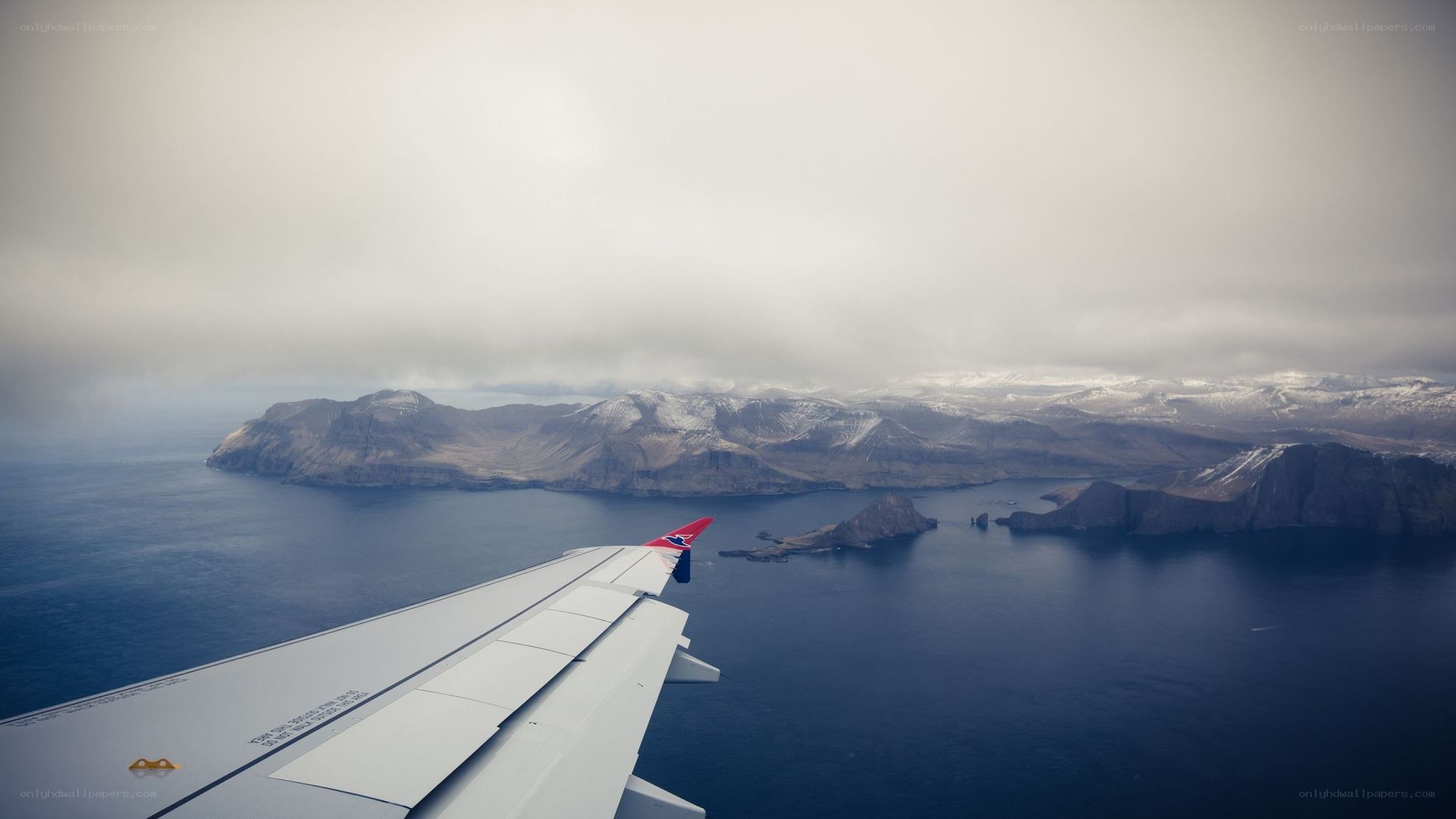 airplane wing over islands