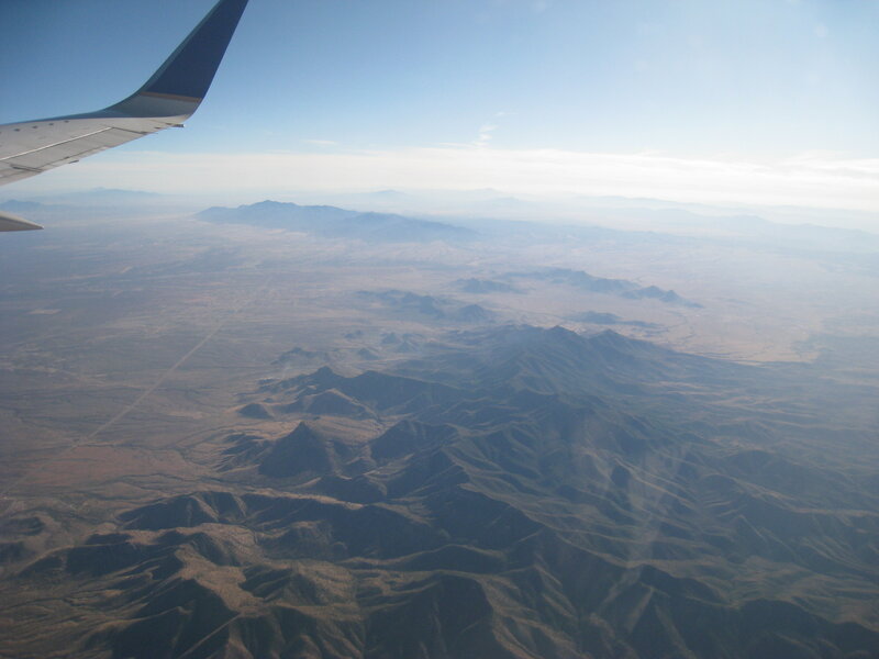 Airplane Wing over Mountains — Blue, Serene, Afternoon