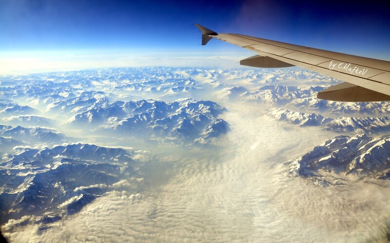 Airplane Wing over Mountains — Blue, Serene, Morning