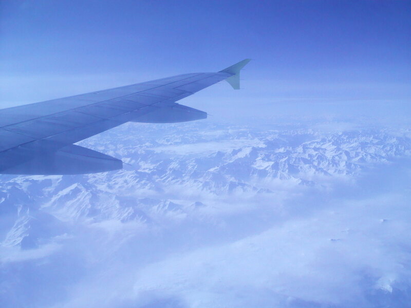 Airplane Wing over Mountains — Blue, Serene