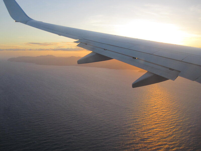 Airplane Wing over Ocean