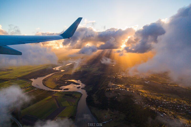 Airplane Wing over River — Blue